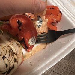 Shish Kabob Express - Produce stickers still stuck onto cooked vegetables.