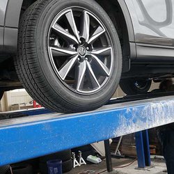 Full Blown Advanced Auto Repair & Car Audio - Drive on lift