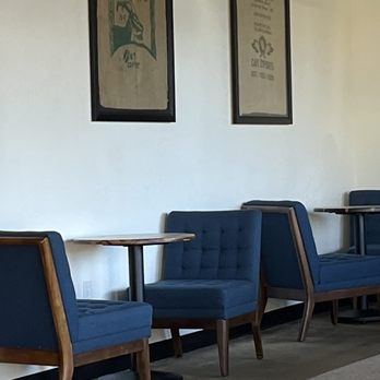Crescent Coffee Roasters - a row of blue chairs - Coffee Roasteries Near Me - Titusville, Florida Crescent Coffee Roasters - a row of blue chairs - Coffee Roasteries Near Me - Titusville, Florida