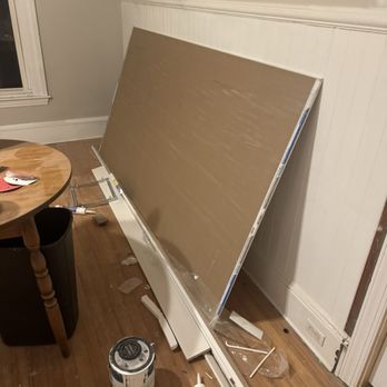 L Veloz - Construction materials scattered on the hardwood floor - Flooring Near Me