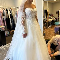 Saja Tailor - Final alterations of dress being done.