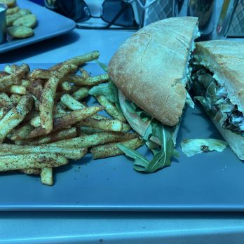 Park City Brewing - Steak Sando with fries, the blue hue is from the overhead tarp. - Barbeque Near Me - Park City, Utah