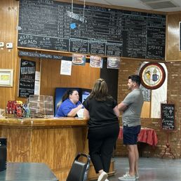 Exceptional staff & menu in the background. Exceptional staff & menu in the background.