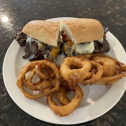 Floaters - Philly Cheese steak and hand dipped onion rings