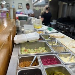 Uptowne Mediterranean Restaurant - Pickles, turnip, olives, garlic