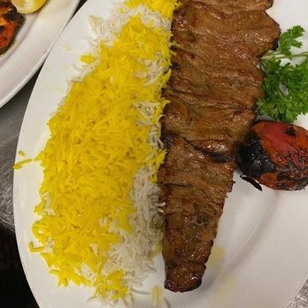 Darya Restaurant - Traditional Iranian Dish:   Chelo Kebab Barg While Rice with saffron,  Grilled Whole Tomatoe  garnished with Italian parsley. - Middle Eastern Near Me - Santa Ana, California