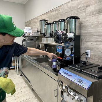 Fruit N Boba Tea - The gentleman is pointing at how the taro boba is being finished in the machine. - Juice Bars & Smoothies Near Me - Rockville, Maryland Fruit N Boba Tea - The gentleman is pointing at how the taro boba is being finished in the machine. - Juice Bars & Smoothies Near Me - Rockville, Maryland