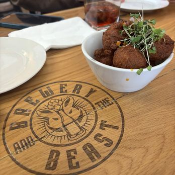 Brewery and the Beast - Crab hushpuppies with orange sauce (in bottom of bowl) - Brewpubs Near Me - Accident, Maryland Brewery and the Beast - Crab hushpuppies with orange sauce (in bottom of bowl) - Brewpubs Near Me - Accident, Maryland