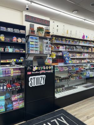 Visit the Shop - Explore premium smoking essentials, from tobacco to vaping supplies, alongside a delectable selection of snacks, beverages, and groceries. Your one-stop destination for quality, community, and convenience. Visit us today! Visit the Shop - Explore premium smoking essentials, from tobacco to vaping supplies, alongside a delectable selection of snacks, beverages, and groceries. Your one-stop destination for quality, community, and convenience. Visit us today!