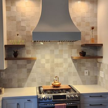 Trade Winds Construction - a kitchen with a range hood - General Contractors Near Me