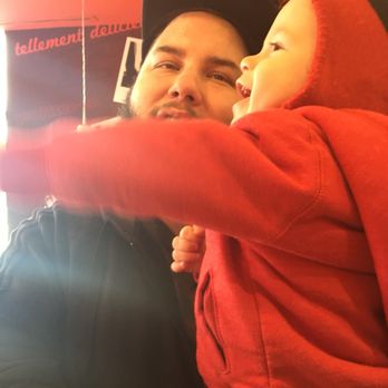 PFK - a man holding a child in his arms - Fast Food Near Me - Kirkland, Quebec PFK - a man holding a child in his arms - Fast Food Near Me - Kirkland, Quebec