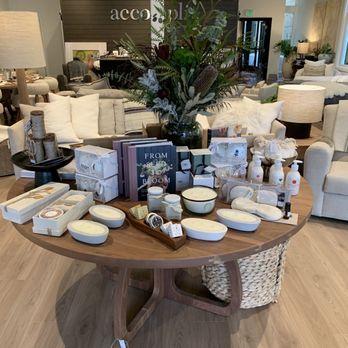 Accompli Home - Table full of candles, lotions, books, etc. - Home Decor Near Me - Calistoga, California Accompli Home - Table full of candles, lotions, books, etc. - Home Decor Near Me - Calistoga, California