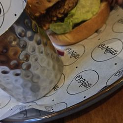 O'Neils - In this photo it is the burger with salad on a brioche bud it came with chips my daughter had this she really really enjoyed it