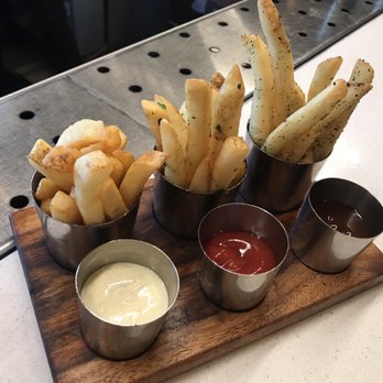 Stripsteak - Duck fat fries sampler- ADDICTING! - Steakhouses Near Me - Honolulu, Hawaii