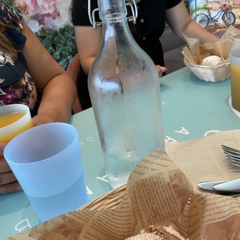 Olenka Peruvian Bistro - Water and a ham & cheese empanada. - Bakeries Near Me - Weston, Florida