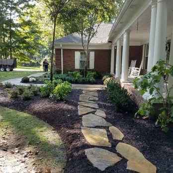 Pinky's Landscape Services - A new landscape installation with a flagstone path. - Landscaping Near Me Pinky's Landscape Services - A new landscape installation with a flagstone path. - Landscaping Near Me