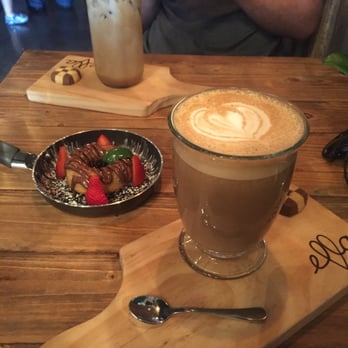 Ella Cafe - Hot vanilla latte with macadamia nut milk, homemade Nutella donut and iced latte - Coffee & Tea Near Me - Plantation, Florida