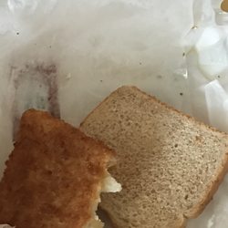 Indi's Fast Food - Cod Fish Sandwich w/ two pieces of wheat bread. This is after I cut it in half.