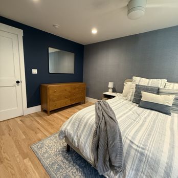 Accurate Painting & Wallpaper - Primary bedroom that got painted and wallpaper accent wall. - Painters Near Me - Newark, New Jersey