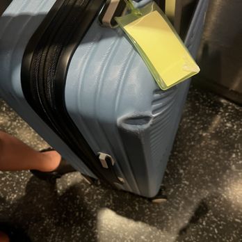 Frontier Airlines - Huge dent in suitcase - Airlines Near Me - Orlando, Florida Frontier Airlines - Huge dent in suitcase - Airlines Near Me - Orlando, Florida