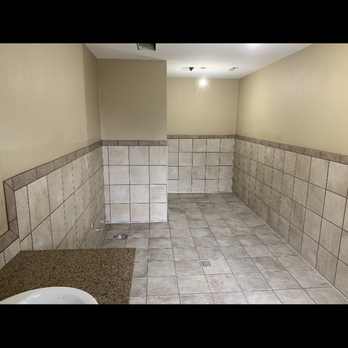 GLFlooring - a bathroom with a sink and toilet - Flooring Near Me