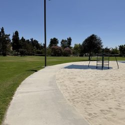 Walking path and basketball court on far end.