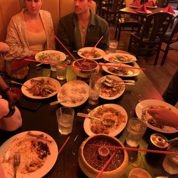 Mandarin House - a group of people sitting at a table with plates of food - Chinese Near Me - La Jolla, California Mandarin House - a group of people sitting at a table with plates of food - Chinese Near Me - La Jolla, California
