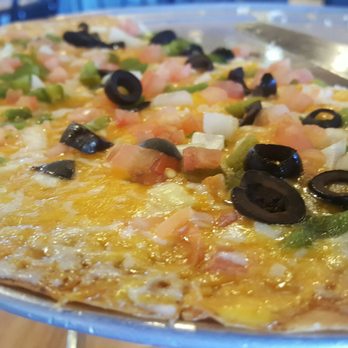 Nana's Kitchen - Cheese crisp topped with white onion, green chilies, tomato and olives. - Mexican Near Me - Tucson, Arizona Nana's Kitchen - Cheese crisp topped with white onion, green chilies, tomato and olives. - Mexican Near Me - Tucson, Arizona