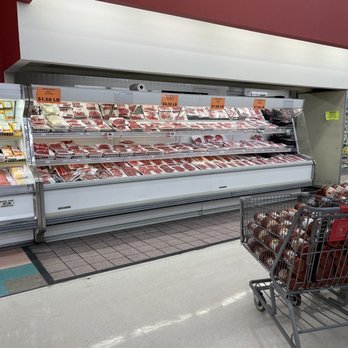 Food Depot - a shopping cart in front of a meat display - Grocery Near Me - Stockbridge, Georgia