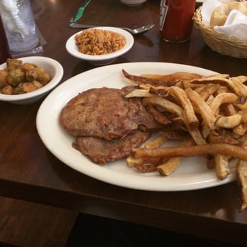 Po Melvin's - Grilled pork chop with fries, fried okra, and jambalaya rice. - American Near Me - Irving, Texas Po Melvin's - Grilled pork chop with fries, fried okra, and jambalaya rice. - American Near Me - Irving, Texas