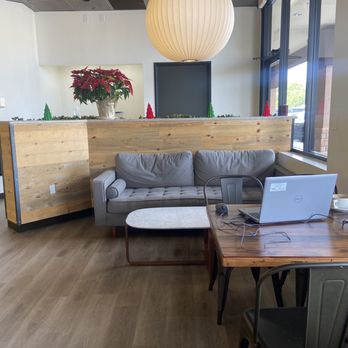 Lola Coffee - a couch and a table with a laptop on it - Coffee & Tea Near Me - Peoria, Arizona