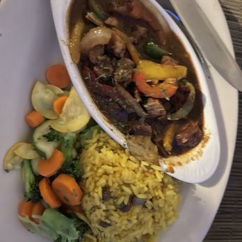 Sugarcane Grille - Spicy jerk pork, seasoned rice, mixed vegetables - Caribbean Near Me - Charlotte Amalie, Virgin Islands