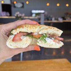 Sweet & Salty Eatery - Bagel sandwich on an Asiago bagel with cream cheese, tomato, onion and spinach.