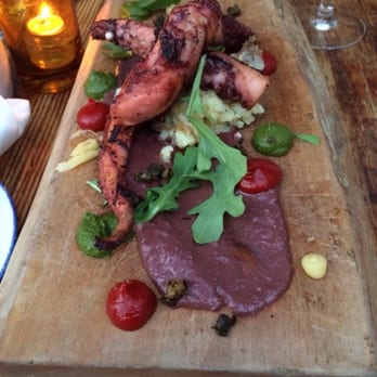 Gusto 101 - Grilled octopus with olive's, pesto (chimichurri), and grilled (smoked) red pepper's pastes, on top of boiled potatoes - Italian Near Me - Toronto, Ontario Gusto 101 - Grilled octopus with olive's, pesto (chimichurri), and grilled (smoked) red pepper's pastes, on top of boiled potatoes - Italian Near Me - Toronto, Ontario