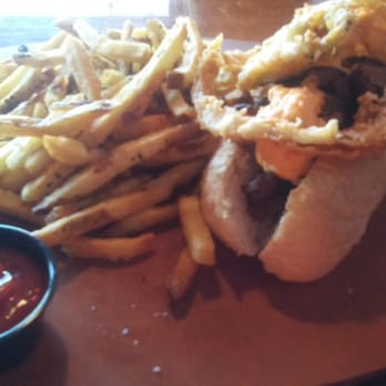 Catch 22 Gastropub - Dirty South Cheese Steak with garlic parm fries. - New American Near Me - Athens, Georgia