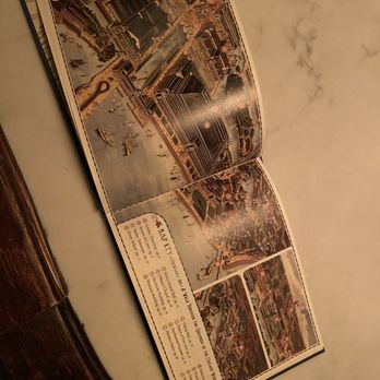 The Meadowlark - A colorful, folded map of Chicago featuring landmarks, attractions, and points of interest, laid open on a table. - Speakeasies Near Me - Chicago, Illinois