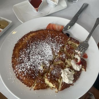 Bottega Louie - Soufflé pancake with Chantilly cream and strawberry sauce. - Italian Near Me - Los Angeles, California Bottega Louie - Soufflé pancake with Chantilly cream and strawberry sauce. - Italian Near Me - Los Angeles, California