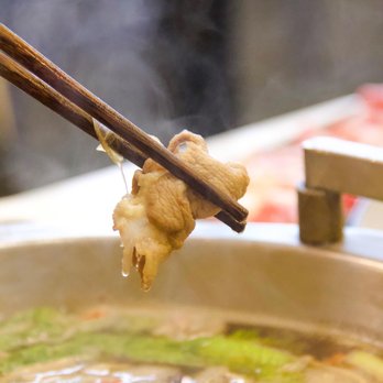 Liu Yi Shou Hotpot - chopsticks holding a piece of meat - Chinese Near Me - Lawrence Township, New Jersey Liu Yi Shou Hotpot - chopsticks holding a piece of meat - Chinese Near Me - Lawrence Township, New Jersey