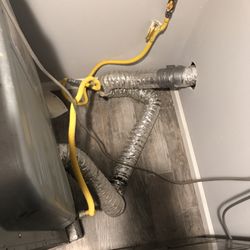 RD Appliance Service - Poorly installed dryer vent using incorrect material and two gas lines coupled together. Make sure your appliances are installed by a pro!