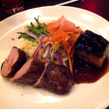 Not Your Average Joe's - Warwick - Pork loin and Pork Belly with Rice Pilaf and pickled carrots and ginger with bean sprouts - New American Near Me - Warwick, Rhode Island Not Your Average Joe's - Warwick - Pork loin and Pork Belly with Rice Pilaf and pickled carrots and ginger with bean sprouts - New American Near Me - Warwick, Rhode Island