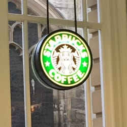 Starbucks - Starbucks sign in the window