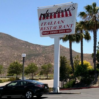 Nicolosi's Italian Restaurant - Parking lot sign (Cowles Mountain in the background) - Italian Near Me - Santee, California Nicolosi's Italian Restaurant - Parking lot sign (Cowles Mountain in the background) - Italian Near Me - Santee, California