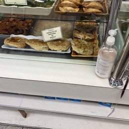 a variety of pastries in a display case