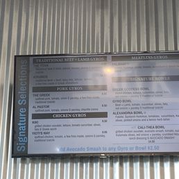 a menu on a metal wall a menu on a metal wall