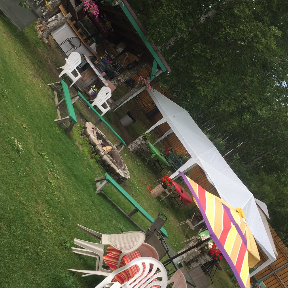 Tug Bar and Liquor - a lawn with chairs and umbrellas - Nightlife Near Me - Wasilla, Alaska Tug Bar and Liquor - a lawn with chairs and umbrellas - Nightlife Near Me - Wasilla, Alaska