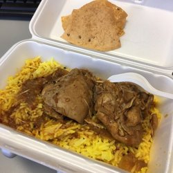 A Taste of India Foods - Lemon rice and chicken curry. Chicken just fell apart, it was so tender.