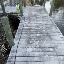 Sunkissed Home Services - Before boat dock being cleaned and sealed