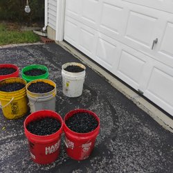 Suburban Sealcoating & Junk Removal - Before patch by garage