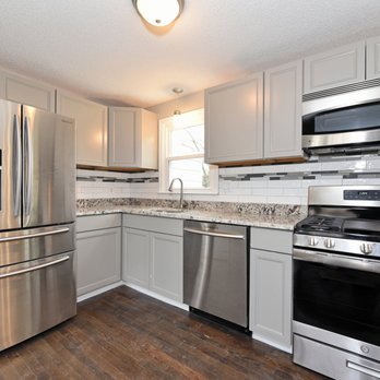 Emery Chase Management - a kitchen with stainless steel appliances - General Contractors Near Me Emery Chase Management - a kitchen with stainless steel appliances - General Contractors Near Me