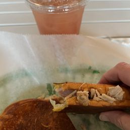 Media Noche sandwich with guava juice beverage.